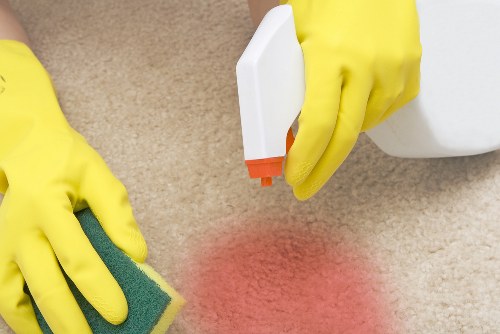 Professional domestic cleaner preparing a modern Canarywharf apartment for a routine home clean