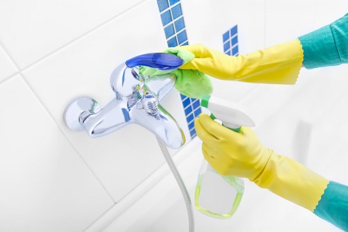 Professional cleaning of dusted curtains in a Canary Wharf living room