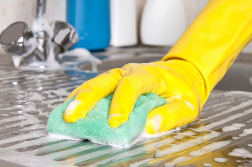 Local technician treating pet urine odour in a modern Canary Wharf home